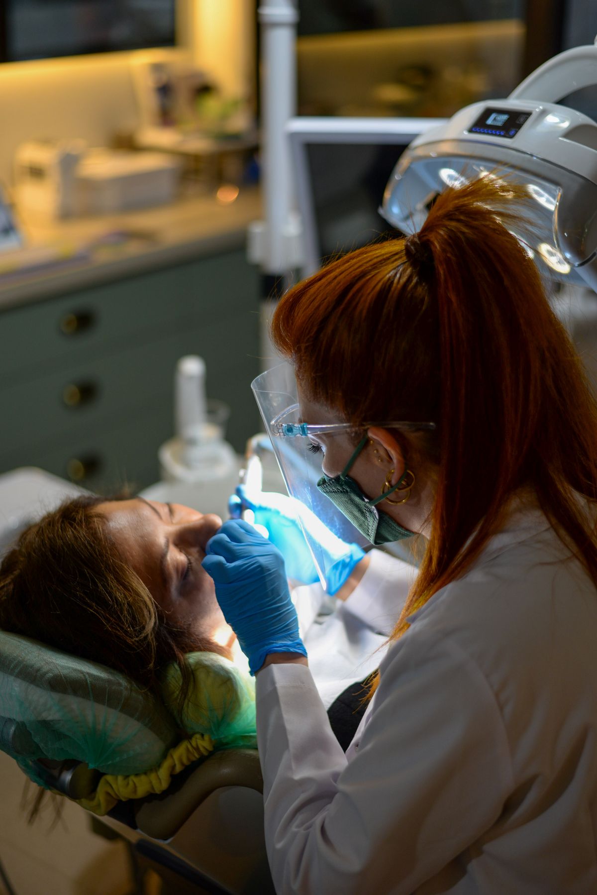 Hygienist performing a gentle cleaning (sample photo)
